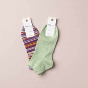 2-pack of plain green and striped lilac sneakers